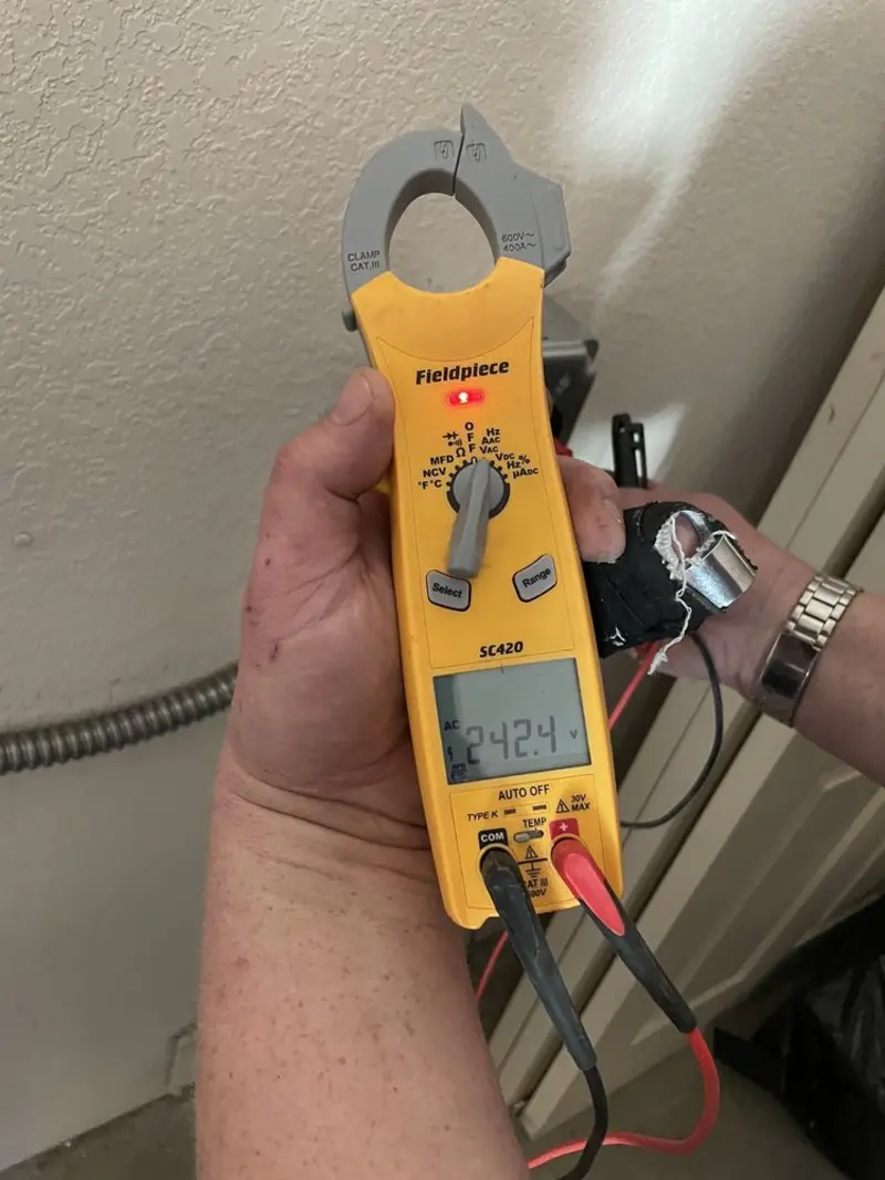 Voltage testing with clamp meter during Outlet Installation in Loudon